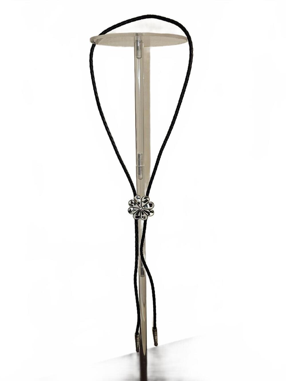 Black bolo tie with silver flower slide